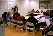 Photo: a "promotora" giving a lecture