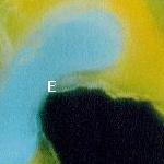 Photomicrograph of a pore cast of a single blob occupying two pore bodies and a throat. Non-wetting nature of the blob is indicated by areas along the walls where water is drawn in toward the blob