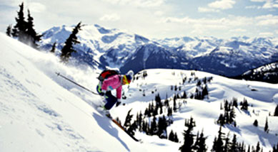 Skiing along mountain backdrop