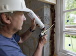 Man fixing window