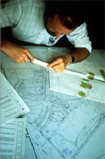 photo:  man with sketch plans