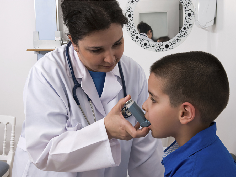 Young boy with inhaler at doctor's office