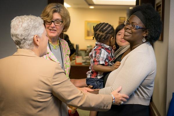 Administrator McCarthy talks with Robenia Chambers and her son, Jeremiah.