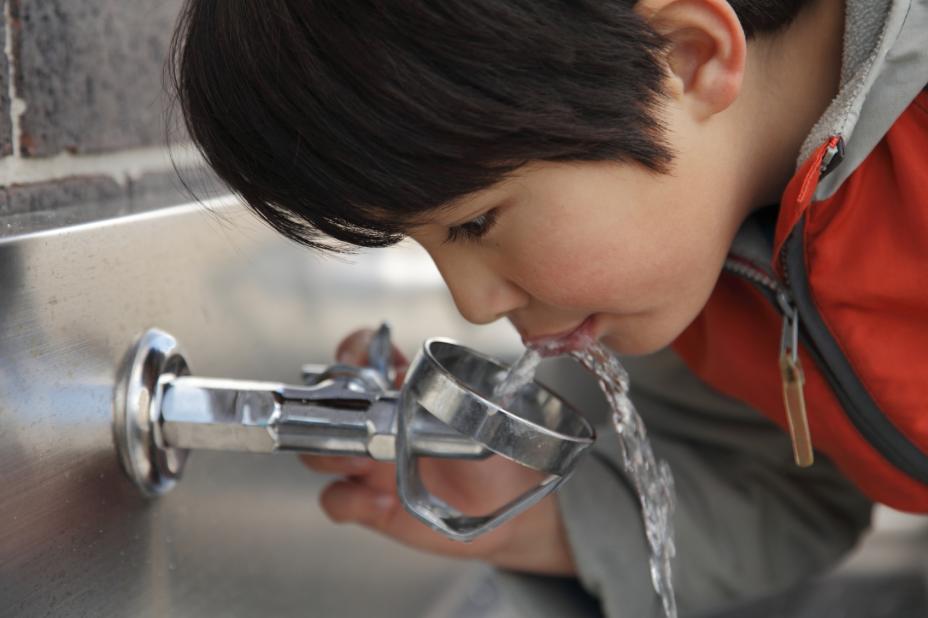 boy at water fountain