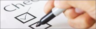 Image of a pen checking off a list