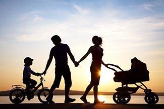 a family walking at sunset