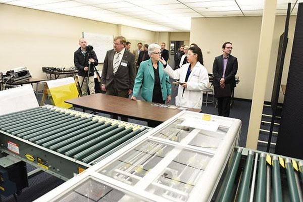 The university has created a simulated assembly line to teach students about the solar panel manufacturing process that is used by solar manufacturers in the Toledo area. Administrator McCarthy got an up-close look. (6 of 11)