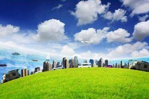 View of a city landscape with green grass and blue skies