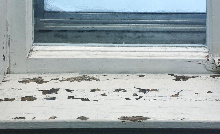 a window with chipping lead paint
