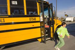 image of school bus with student exiting