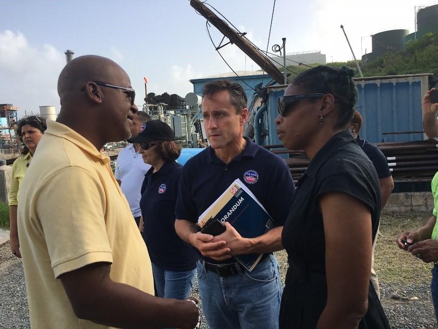 EPA Regional Administrator Pete López visiting a battery staging area in St. Thomas with USVI Water and Power Authority CEO Julio Rhymer, USVI Department of Planning & Natural Resources Commissioner Dawn Henry