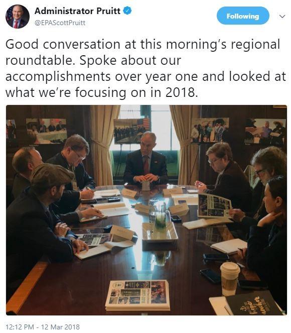 Screenshot of tweet of man in blue suit and red tie (Administrator Pruitt) at head of wood conference table speaking with six people seated on both sides of the table.