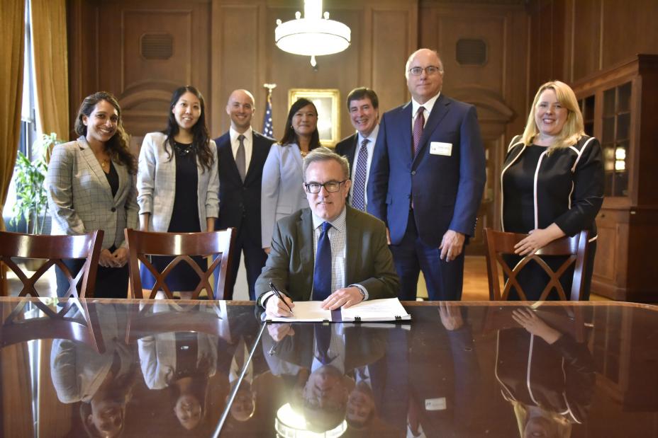 Acting Administrator Wheeler (front) signs the San Francisco Public Utilities Commission WIFIA loan agreement 