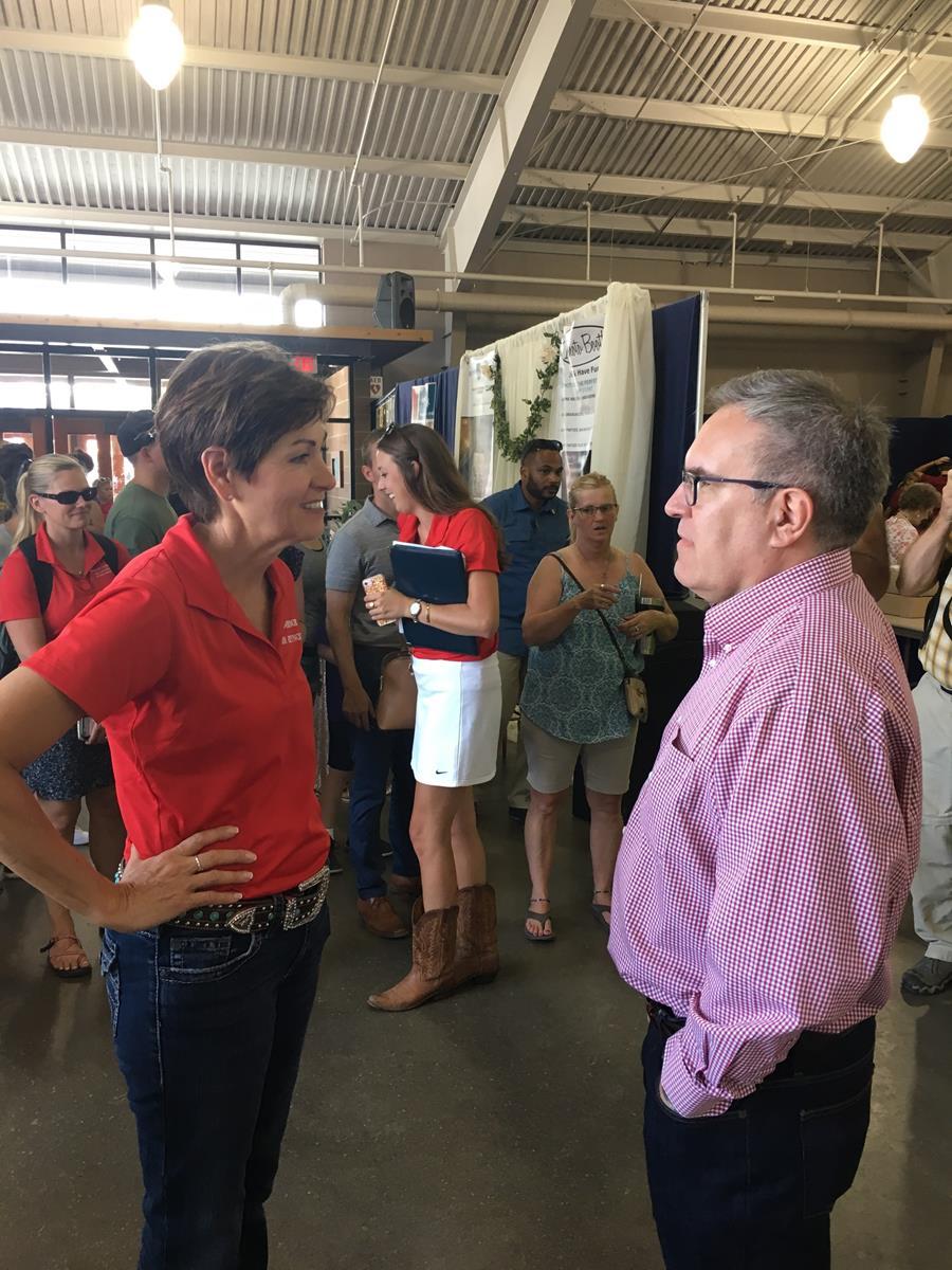 Acting Administrator Wheeler and Iowa Governor Kim Reynolds in a large hall