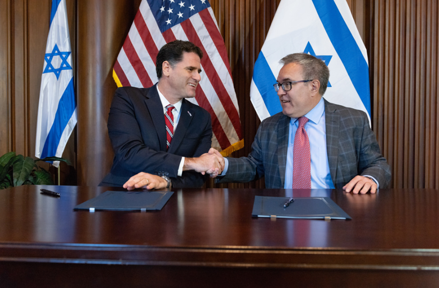 Wheeler shaking hands with the Israeli ambassador