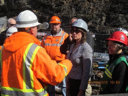 Rep. Cheri Bustos and U.S. EPA Regional Administrator Susan Hedman are briefed on cleanup progress at the site of the derailed oil train.