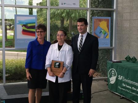 SF Environment Director, Debbie Raphael and EPA Regional Administrator, Jared Blumenfeld stand with award winner, Marlene Samson.