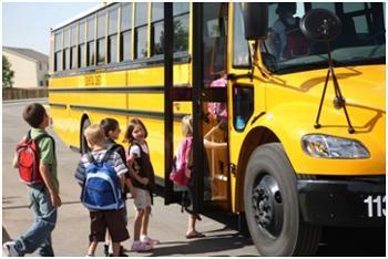 kids getting on the bus