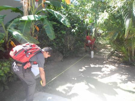 Two men helping the Vieques Conservation and Historical Trust conduct a septic tank survey. 