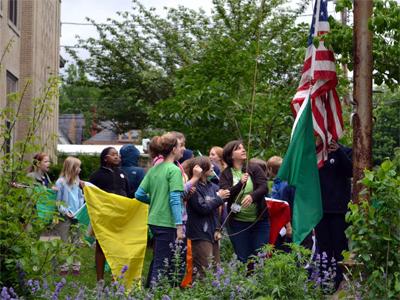 children raising a flag