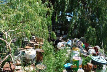 corroded hazardous waste containers and drums on spatig's property
