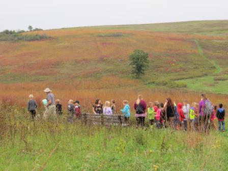 Students learn about prairie restoration by collecting seeds and planting them on school grounds. Photo courtesy of Wisconsin Wildlife Federation’s Green Schools Network.