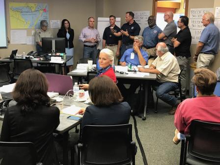 EPA Administrator Scott Pruitt is debriefed on recovery efforts at the Port of Corpus Christi Emergency Operations Center.