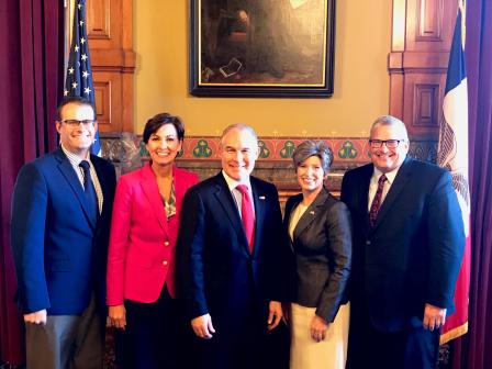 Standing before two flags, Iowa Lt. Adam Gregg (left), Iowa Governor Kim Reynolds (second from left), EPA Administrator Scott Pruitt (middle), U.S. Senator Joni Ernst (second from right), and Iowa Secretary of Agriculture Bill Northey (right). 