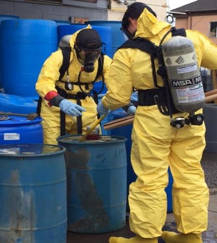 Inspectors from California’s Department of Toxic Substances Control collecting hazardous waste samples. Photo credit: CA Department of Toxic Substances Control.