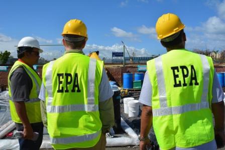 the backs of EPA workers in hard hats