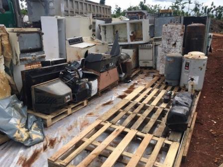 photo of a junkyard filled with junked items such as TVs, or large appliances