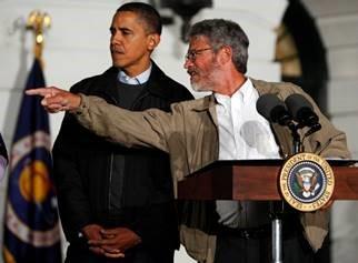 President Obama standing at podium.