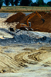Bulldozer working at landfill site