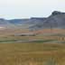 Buttes and grassland/rangeland with some strip cropping