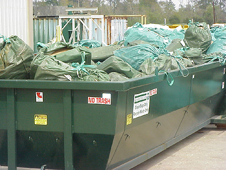 Recyclables which have been sorted and compacted on the rig, are shipped in the green bags to the rig’s dock facility for storage in bins labeled “Green Bags Only—Recycle Waste Only”. The bins containing compacted tin, aluminum, cardboard, plastic and paper are periodically picked up by Tech Oil Products and returned to the Tech Oil yard where they are inventoried.