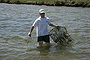 Government Category - 2nd Place: Jeff Rester, Gulf States Marine Fisheries Commission, removing a derelict crab trap from Pointe Aux Chenes Bay, Mississippi.