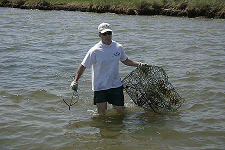 Government Category - 2nd Place: Jeff Rester, Gulf States Marine Fisheries Commission, removing a derelict crab trap from Pointe Aux Chenes Bay, Mississippi.