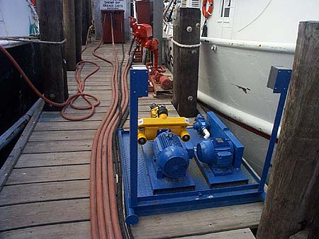 With the split systems, the pumps are mounted on a separate skid for
placement at the facility's fuel docks.  With this arrangement the tanks
can be located away from the docks while the pumps are conveniently located
for facility operators.  Since installation in the Spring the Units have
recovered more than 50,000 gallons of contaminated bilgewater and over
5,000 gallons of waste engine oil.