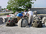 High School Volunteers from Saint Stephens Episcopal School of Bradenton, FL stand amid the many reef balls they helped construct at Reef Innovations, Inc. in Sarasota, FL