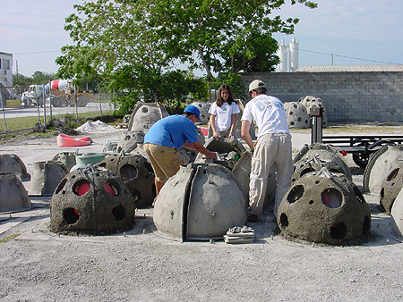 High School Volunteers from Saint Stephens Episcopal School of Bradenton, FL stand amid the many reef balls they helped construct at Reef Innovations, Inc. in Sarasota, FL</p>