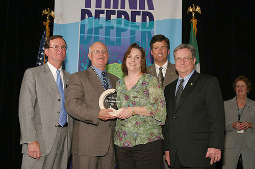 Presentation of the Gulf Guardian Award for Individual, 2nd Place, to Dawn Rebarchik of the Gulf Coast Research Laboratory of Ocean Springs, Mississippi.  From left, Dr. Bill Walker; Phil Bass; winner Dawn Rebarchik; Bryon Griffith, Director of the Gulf of Mexico Program; and Mayor Richard Greene, EPA Region 6 Administrator.