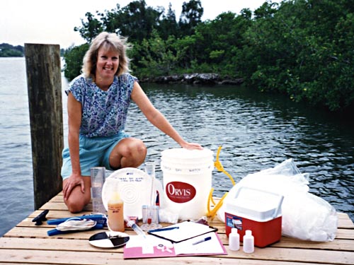 Photo 1: Betsy Marlowe, a Nature Conservancy Volunteer, prepares to collect a weekly water sample for the Florida Baywatch program.