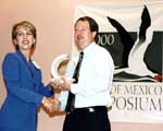 Lori Koen Slavich receives award from Barry Royals