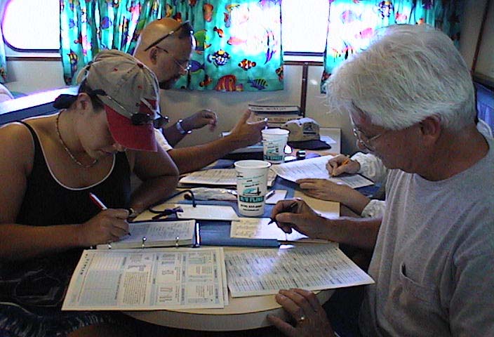 Photo 3: Educators complete the paperwork to submit their fish surveys to the Reef Environmental Education Foundation for inclusion in the database. 