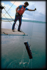 Vertical sampler being raised from lake