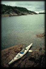 Kayak beached on rock, Lake Superior Pakaskwa National Park, Ontario