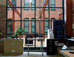 A view from a Miller's Court apartment with its large windows for daylighting. A view from a Miller's Court apartment with its large windows for daylighting.
