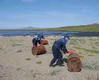 Volunteers collecting drums
