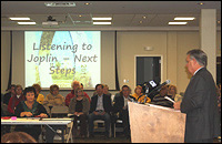 State Senator Ron Richard (at podium) leads a joint meeting in January 2012 of the Joplin Community Advisory Recovery Team, Joplin City Council, Duquesne City Council, Joplin Chamber of Commerce Board, and Joplin School Board to endorse the Joplin Area - Next Steps Plan. 