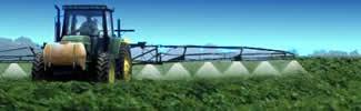 image of tractor spraying pesticides on crops